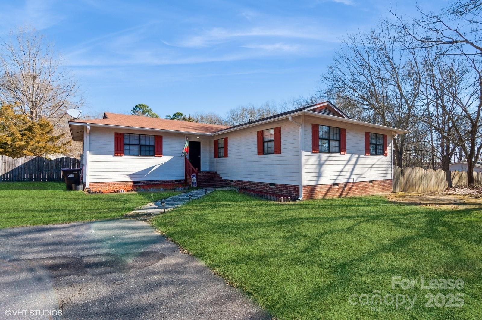 9938 Sandra Lane Fort Mill, SC 29707 - Photo 2 of 36 a front view of a house with a yard