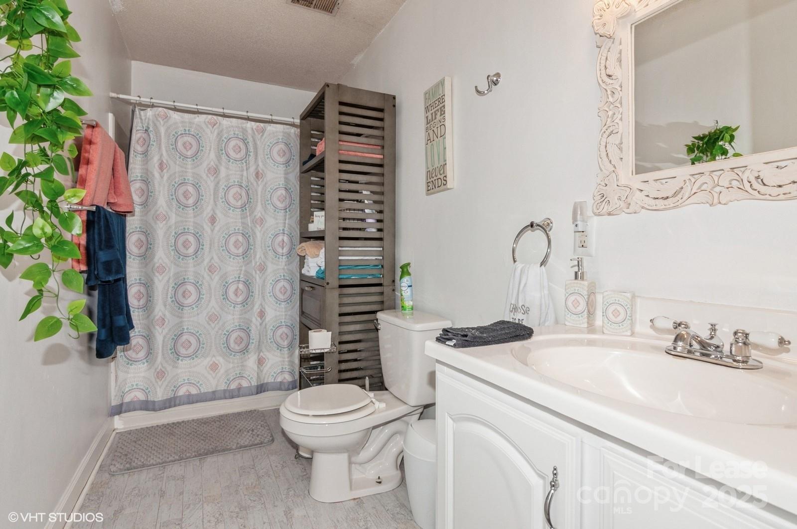 9938 Sandra Lane Fort Mill, SC 29707 - Photo 23 of 36 a bathroom with a sink toilet and shower