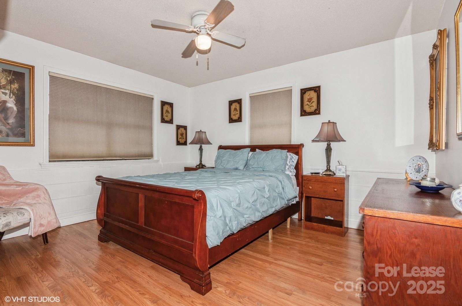 9938 Sandra Lane Fort Mill, SC 29707 - Photo 24 of 36 a bedroom with a bed and wooden floor