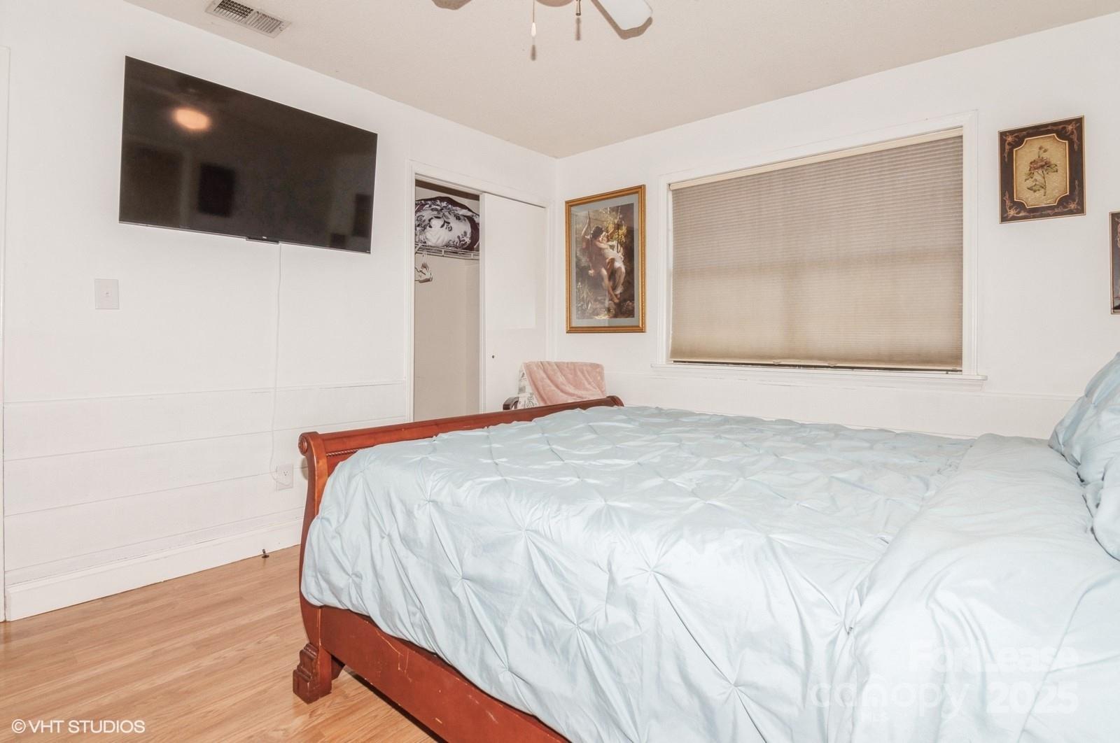 9938 Sandra Lane Fort Mill, SC 29707 - Photo 25 of 36 a bedroom with a bed and a flat screen tv