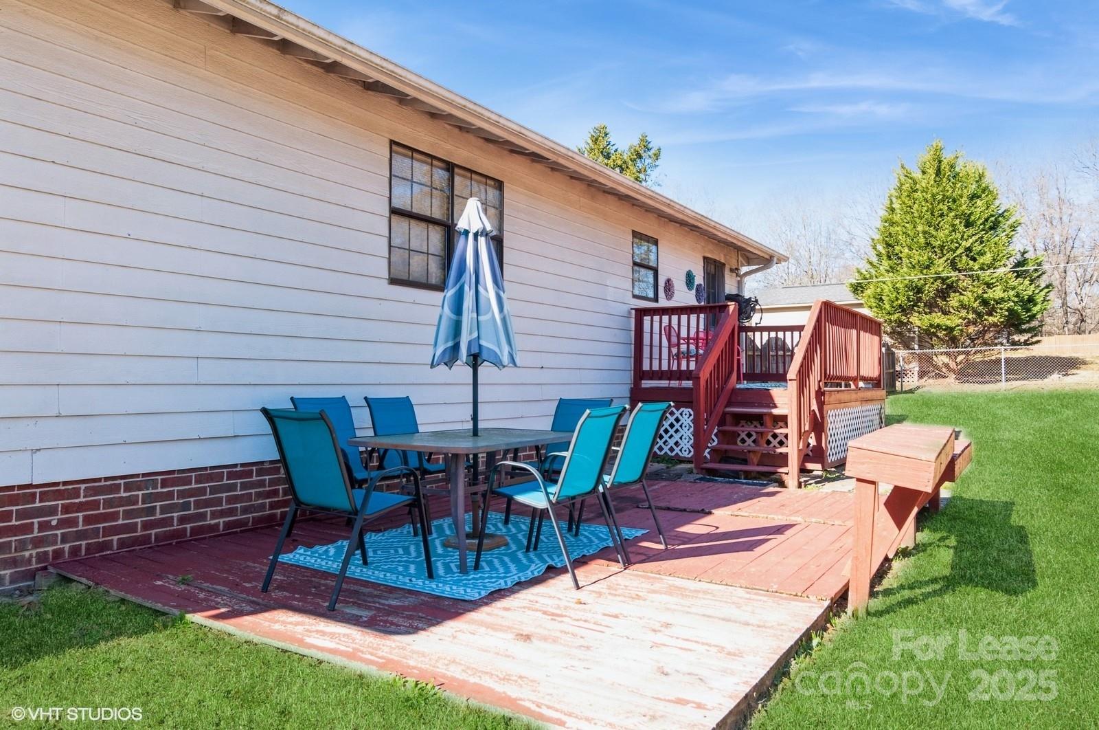 9938 Sandra Lane Fort Mill, SC 29707 - Photo 27 of 36 a backyard of a house with outdoor seating