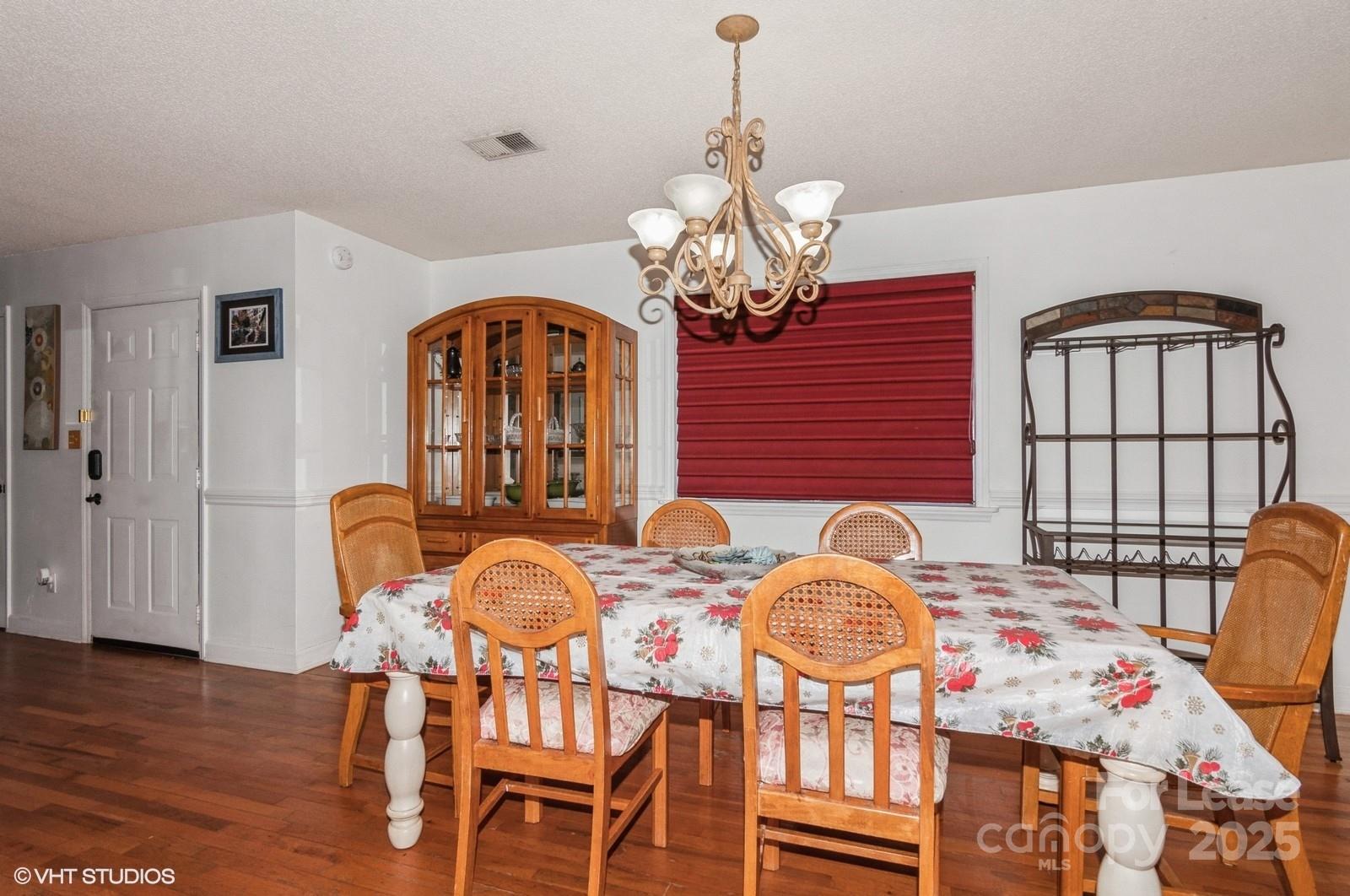 9938 Sandra Lane Fort Mill, SC 29707 - Photo 6 of 36 a view of a dining room with furniture and wooden floor