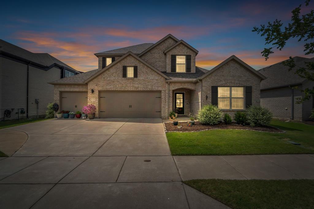 6938 Prairieside Trail Venus, TX 76084 - Photo 1 of 1 a front view of a house with a yard and garage