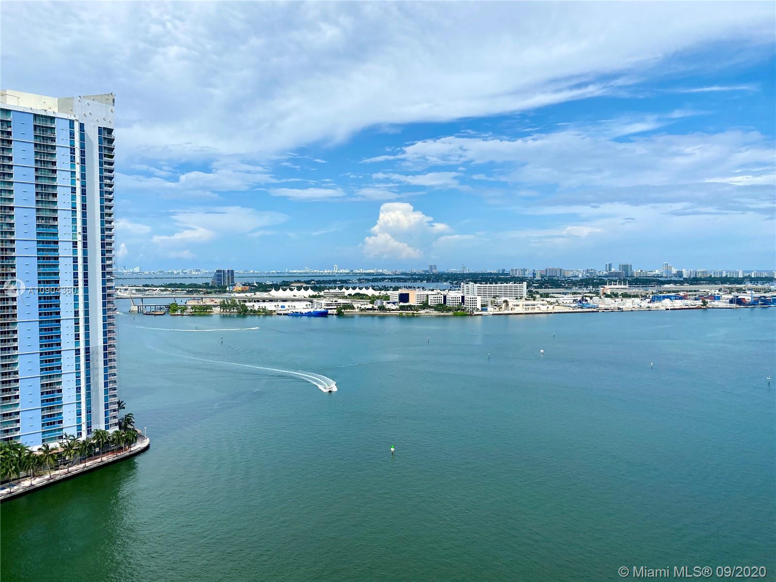 900 Brickell Key Boulevard, Unit 2001 Miami, FL 33131 - Photo 21 of 22 a view of an ocean with city