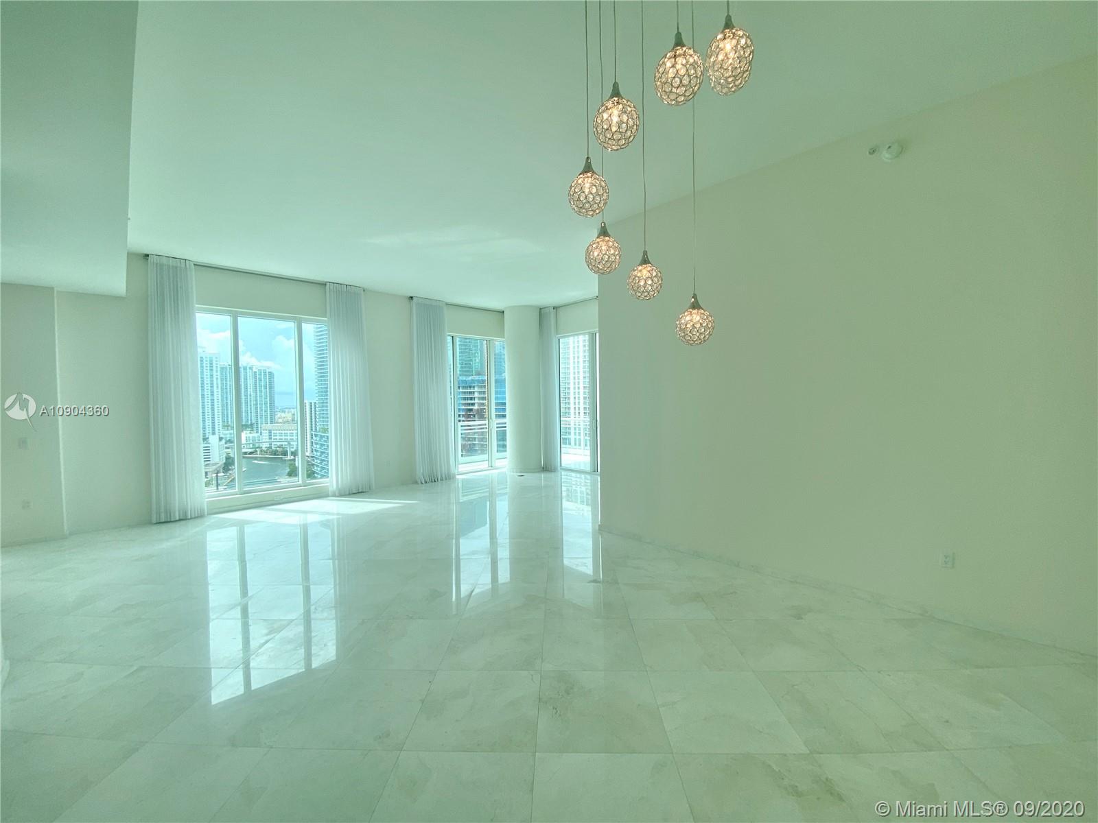 900 Brickell Key Boulevard, Unit 2001 Miami, FL 33131 - Photo 5 of 22 a view of livingroom with chandelier