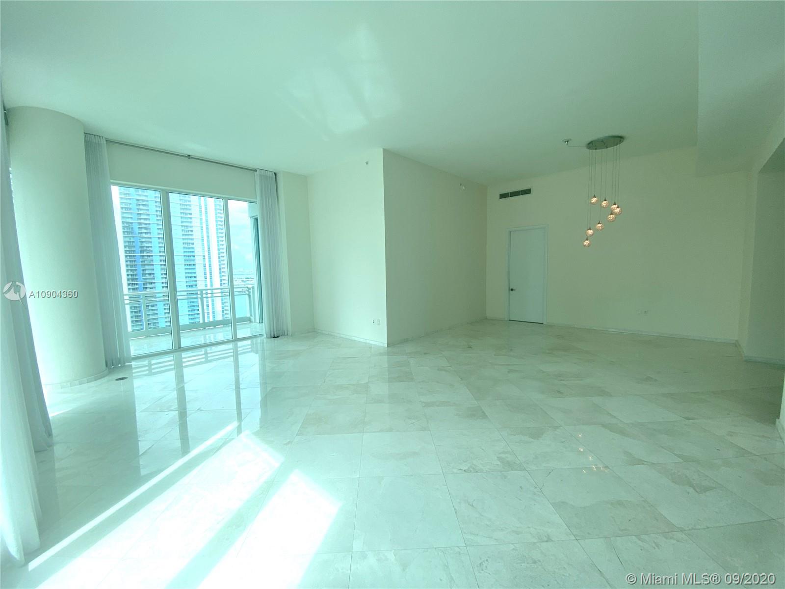 900 Brickell Key Boulevard, Unit 2001 Miami, FL 33131 - Photo 6 of 22 a view of an empty room with a window