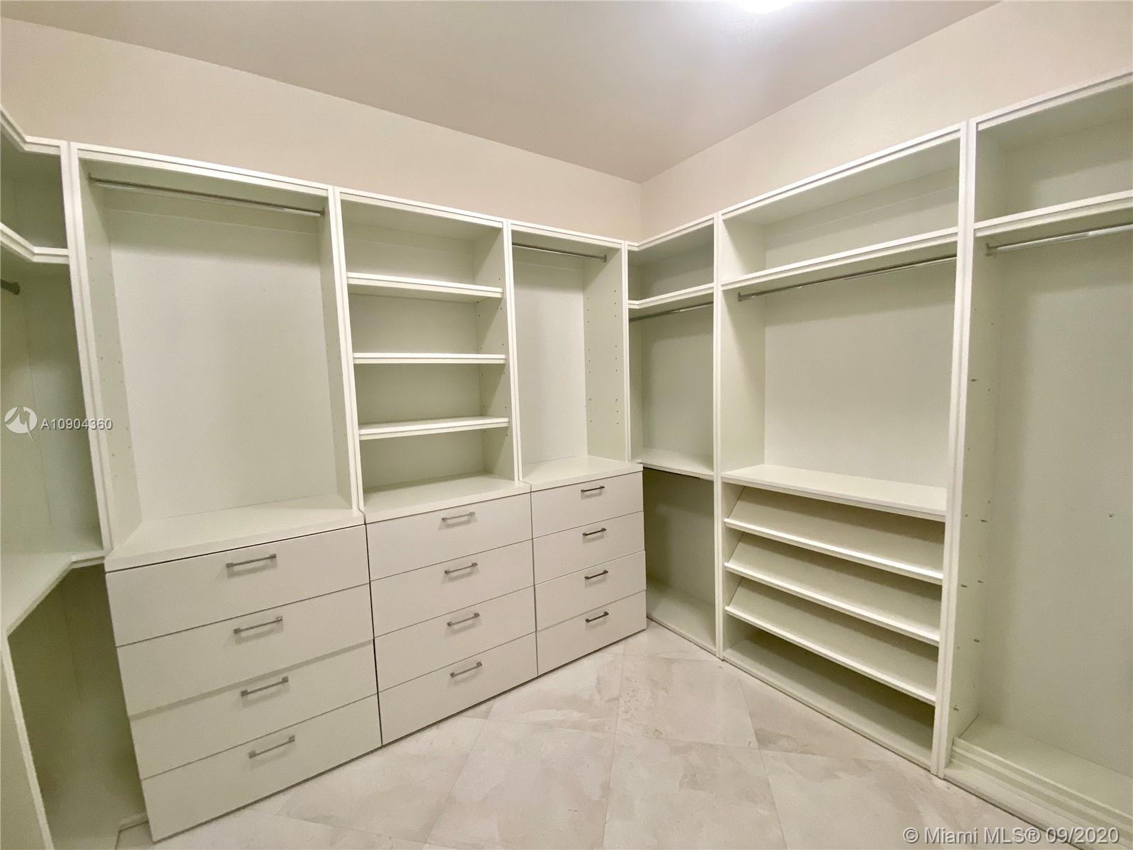 900 Brickell Key Boulevard, Unit 2001 Miami, FL 33131 - Photo 10 of 22 a view of an empty walk in closet