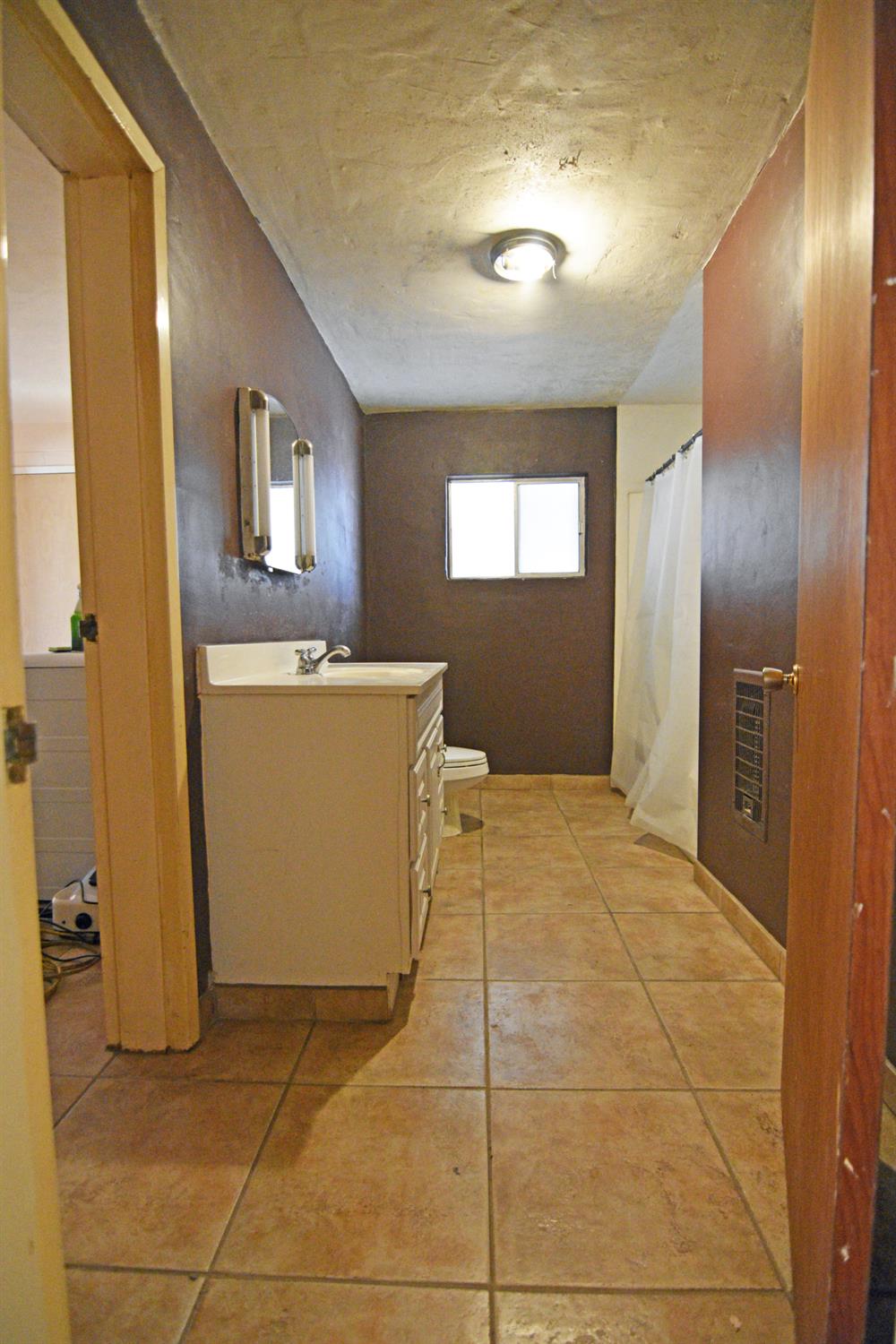 1206 South Verduga Road Turlock, CA 95380 - Photo 16 of 36 a view of a kitchen with a sink and a refrigerator