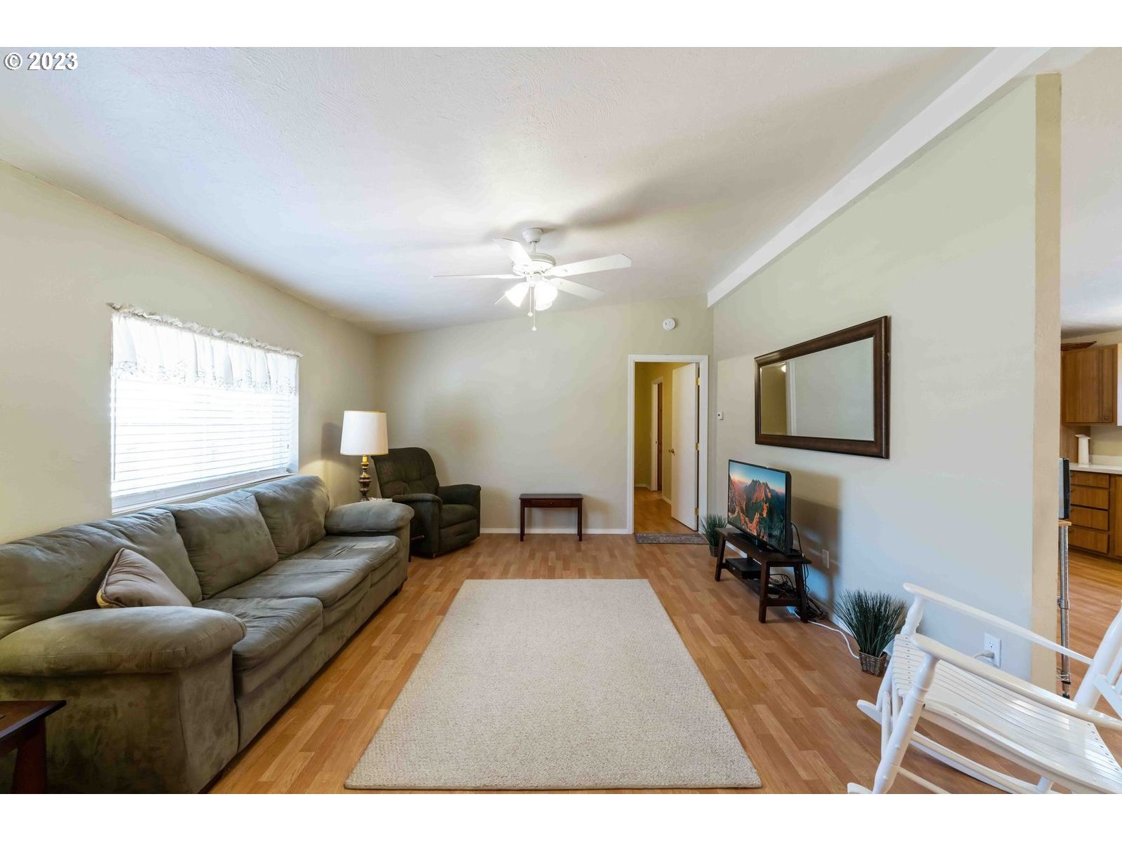 150 North 11th Street Lakeside, OR 97449 - Photo 12 of 24 a living room with furniture a rug and a window