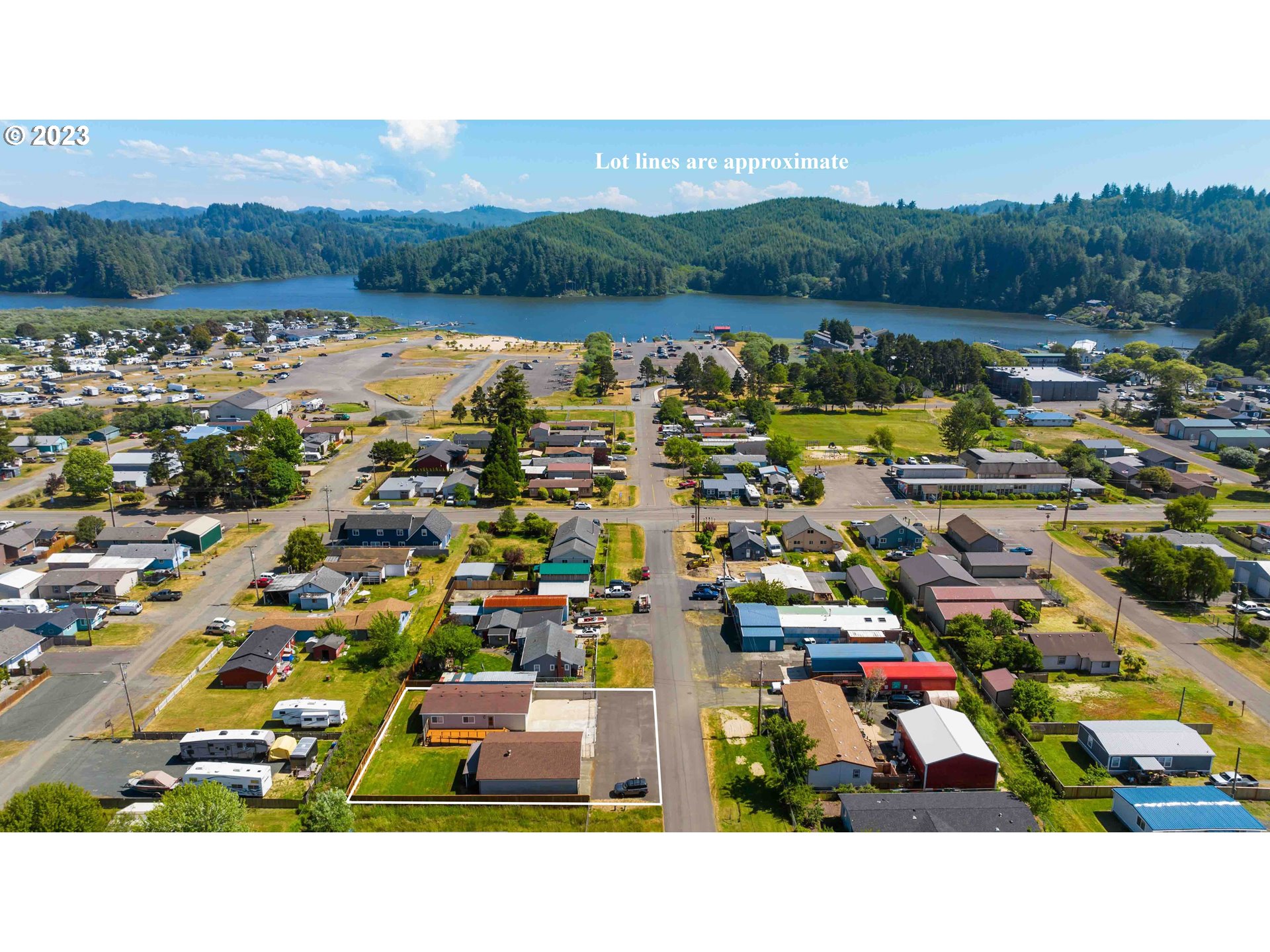 150 North 11th Street Lakeside, OR 97449 - Photo 3 of 24 a picture of houses with outdoor space and lake view