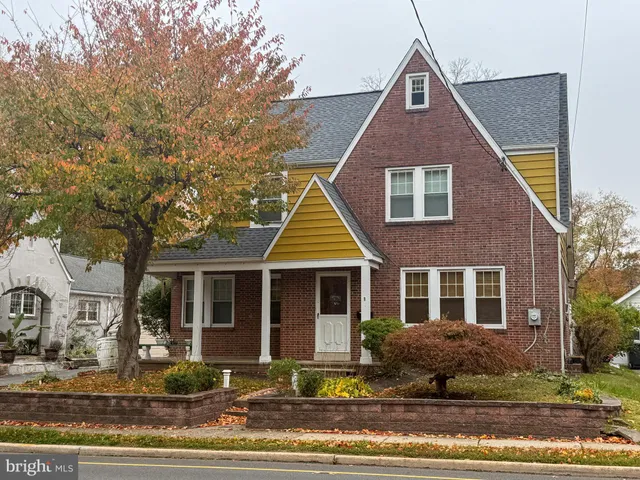 a front view of a house with yard