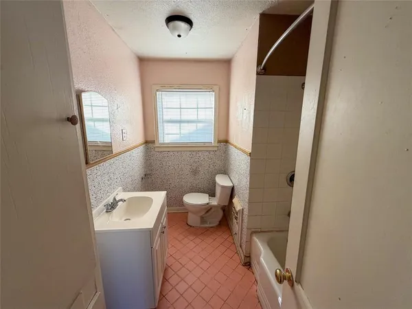 a bathroom with a sink and toilet