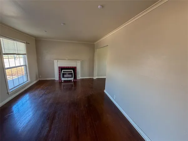 a view of a livingroom with wooden floor