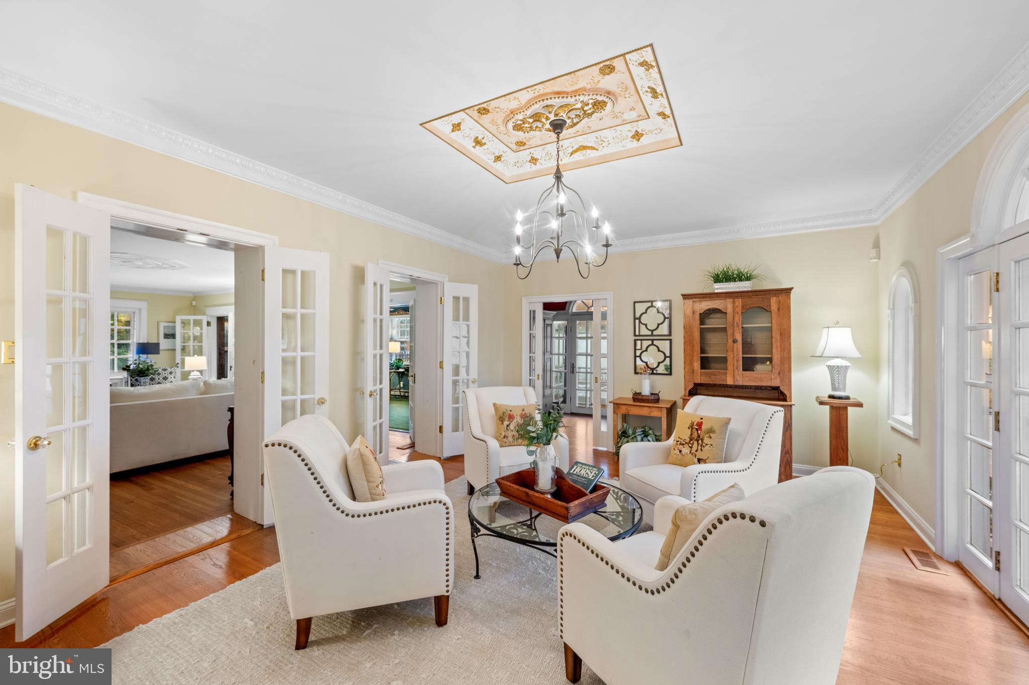 328 Conestoga Road Wayne, PA 19087 - Photo 18 of 72 a living room with furniture a chandelier and a dining table