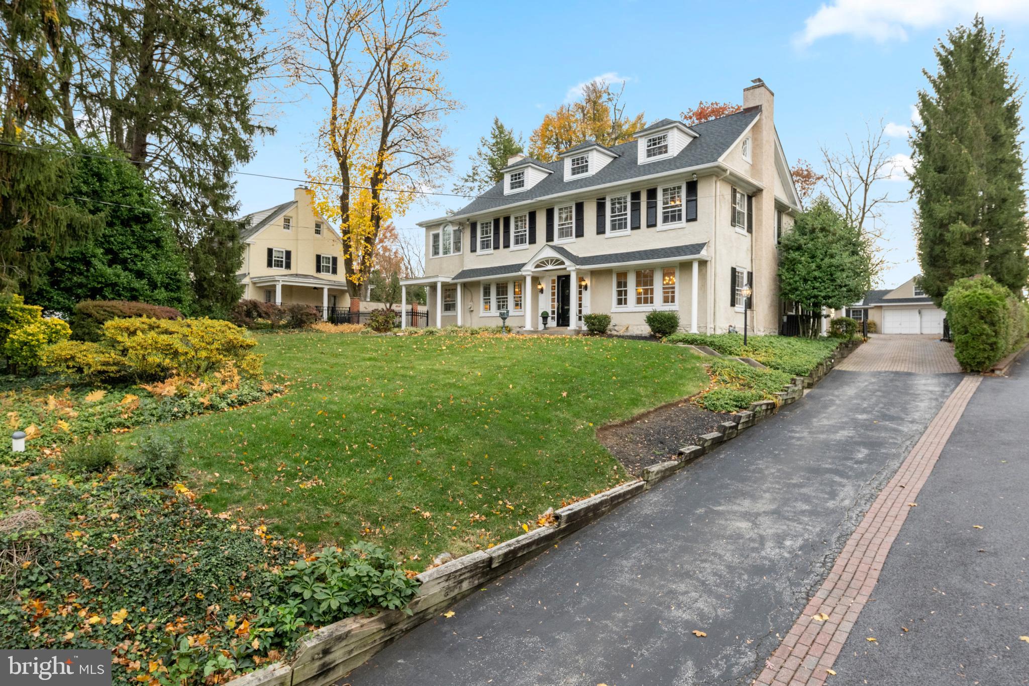 328 Conestoga Road Wayne, PA 19087 - Photo 2 of 72 a front view of a house with a garden