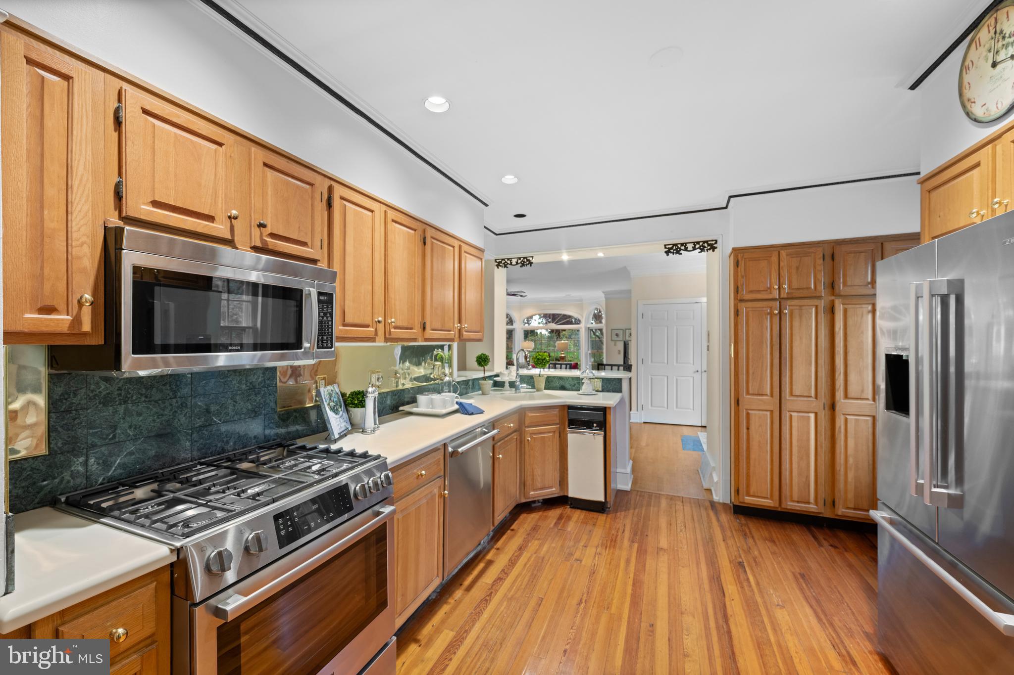 328 Conestoga Road Wayne, PA 19087 - Photo 29 of 72 a kitchen with stainless steel appliances granite countertop a stove top oven a sink dishwasher a refrigerator and a microwave