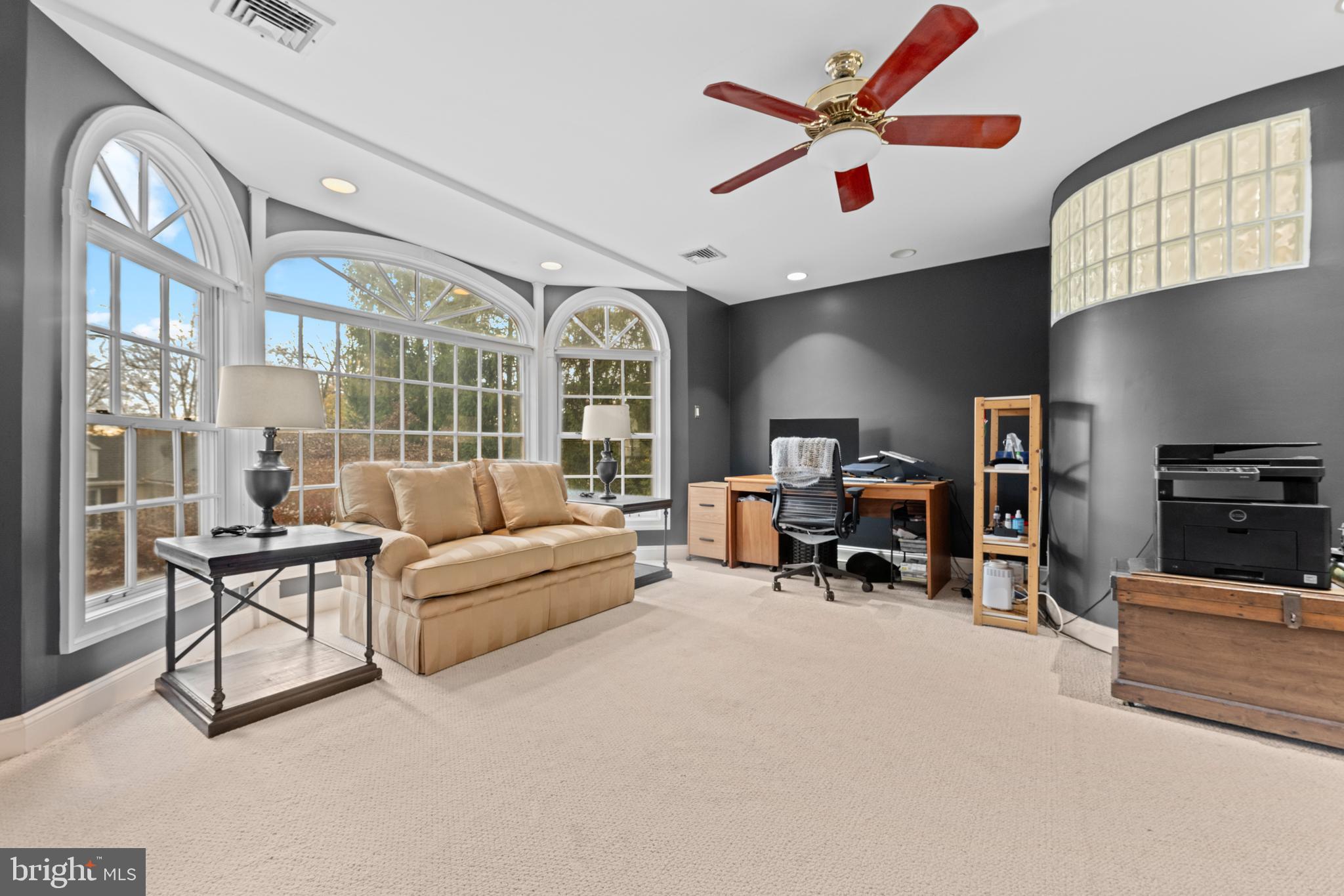 328 Conestoga Road Wayne, PA 19087 - Photo 37 of 72 a living room with furniture a dining table and chairs with a large window