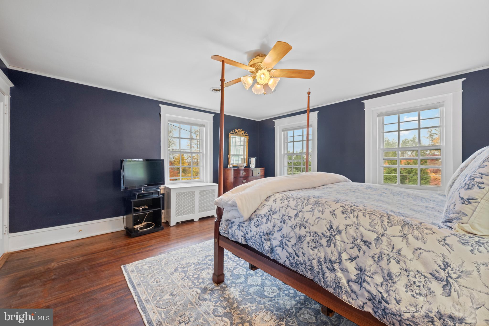 328 Conestoga Road Wayne, PA 19087 - Photo 40 of 72 a bedroom with a bed a mirror on desk and chair