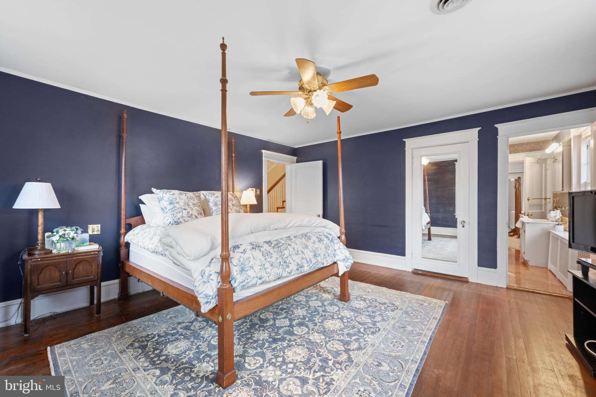 328 Conestoga Road Wayne, PA 19087 - Photo 42 of 72 a bedroom with a bed rug and wooden floor