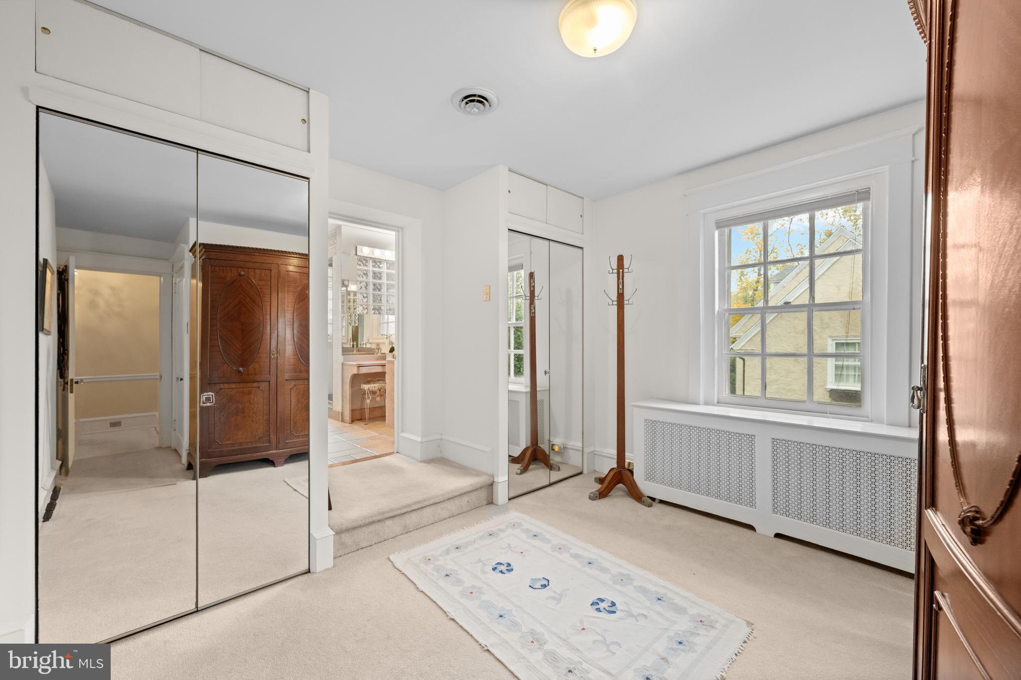 328 Conestoga Road Wayne, PA 19087 - Photo 44 of 72 a view of a bathroom with a tub shower and mirror