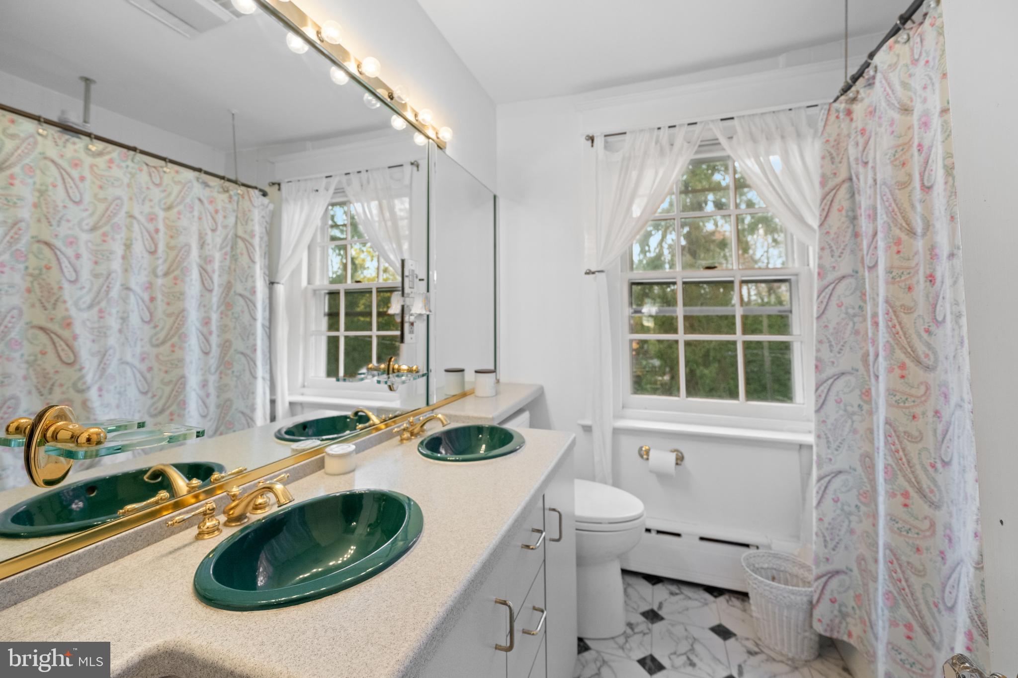 328 Conestoga Road Wayne, PA 19087 - Photo 48 of 72 a bathroom with a granite countertop sink and a window
