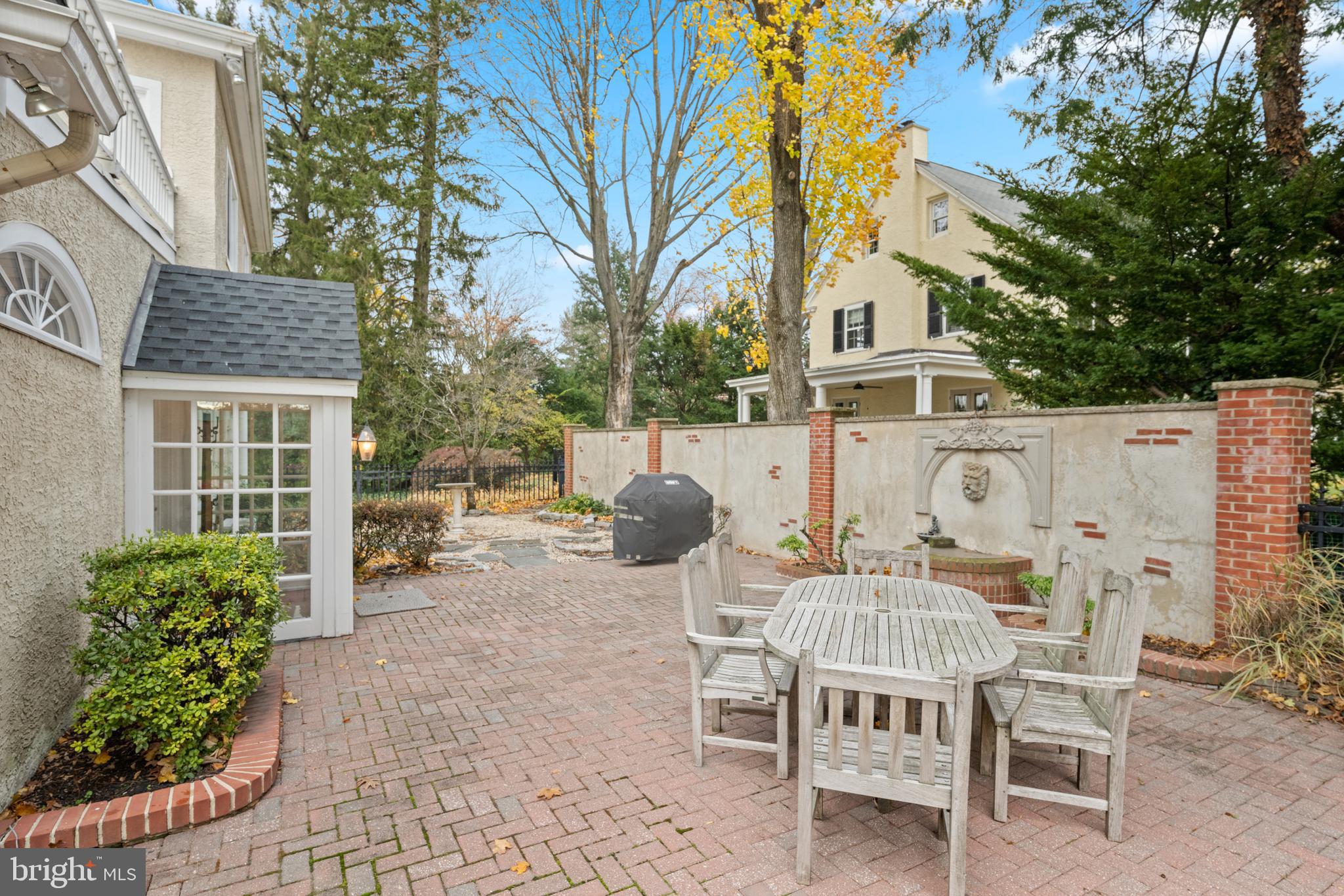328 Conestoga Road Wayne, PA 19087 - Photo 61 of 72 a view of a patio with table and chairs and potted plants