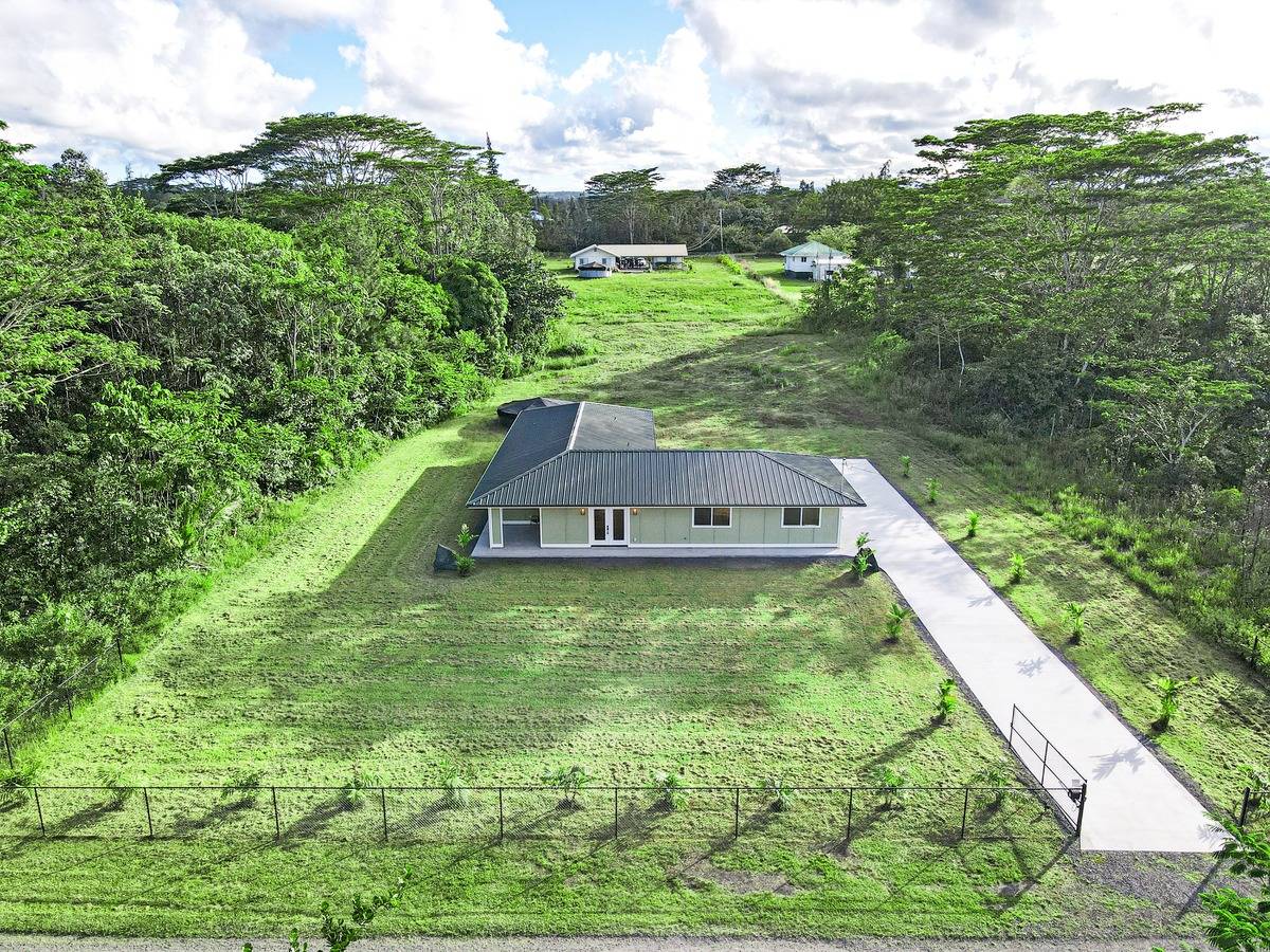 a aerial view of a house having yard