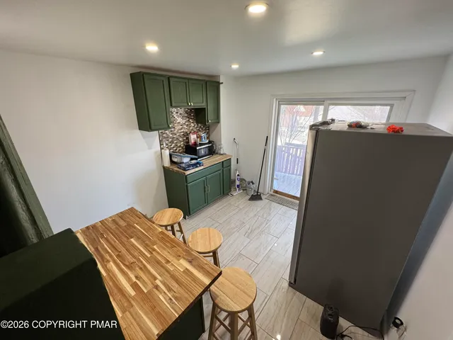 a bed room with a bed furniture and a flat screen tv