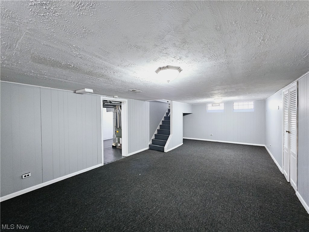 884 Yellowstone Road Cleveland Heights, OH 44121 - Photo 15 of 17 Basement with a textured ceiling and dark colored carpet