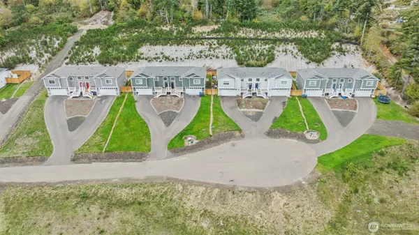 an aerial view of residential houses with outdoor space