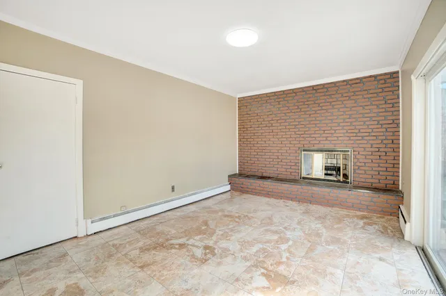 an empty room with a fireplace