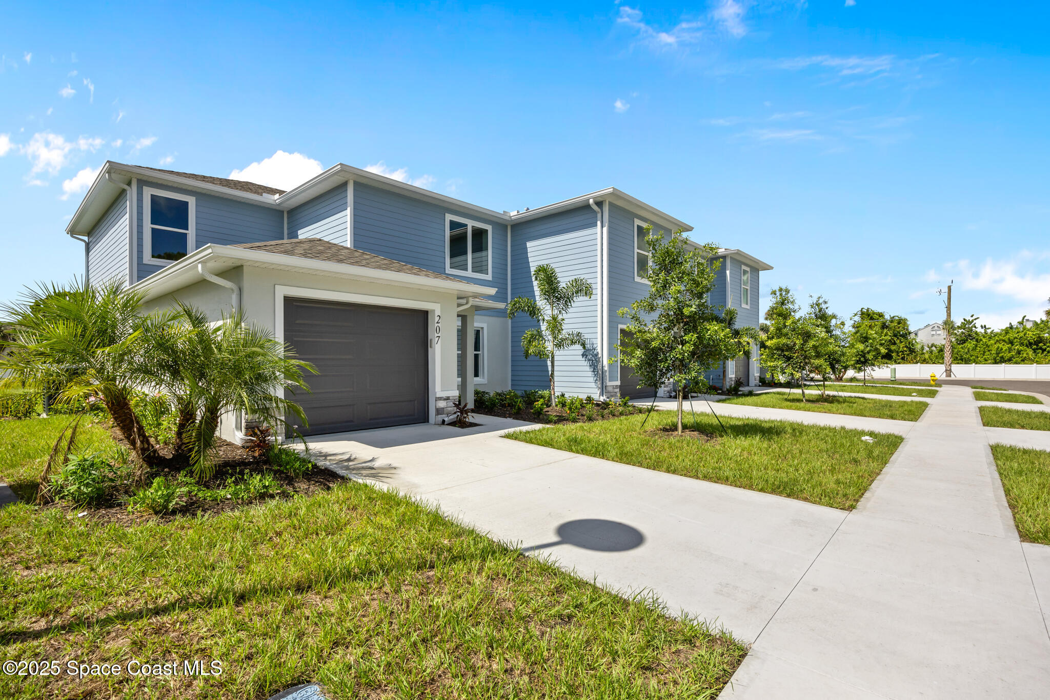 207 Hidden Woods Place Melbourne, FL 32901 - Photo 2 of 33 a house view with a garden space