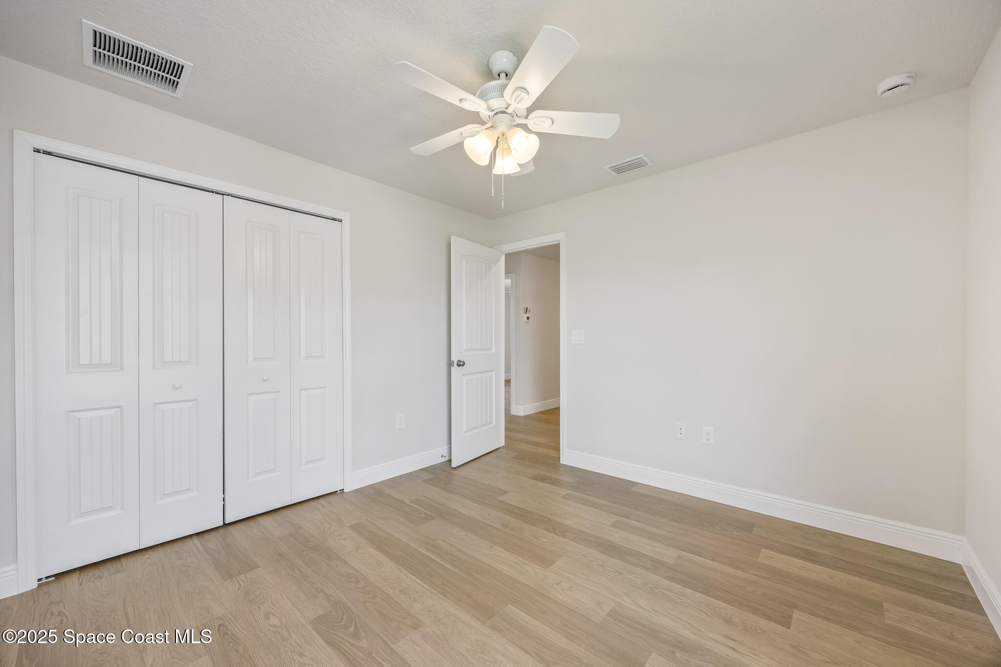 207 Hidden Woods Place Melbourne, FL 32901 - Photo 30 of 33 wooden floor in an empty room