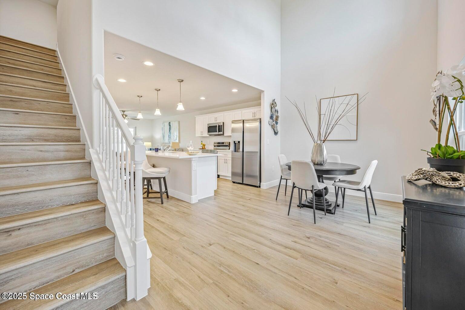 207 Hidden Woods Place Melbourne, FL 32901 - Photo 4 of 33 a living room with furniture and a wooden floor