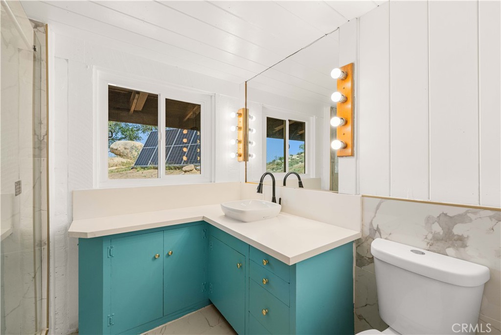 6308 Hawarden Drive Riverside, CA 92506 - Photo 22 of 37 a bathroom with a sink and a toilet