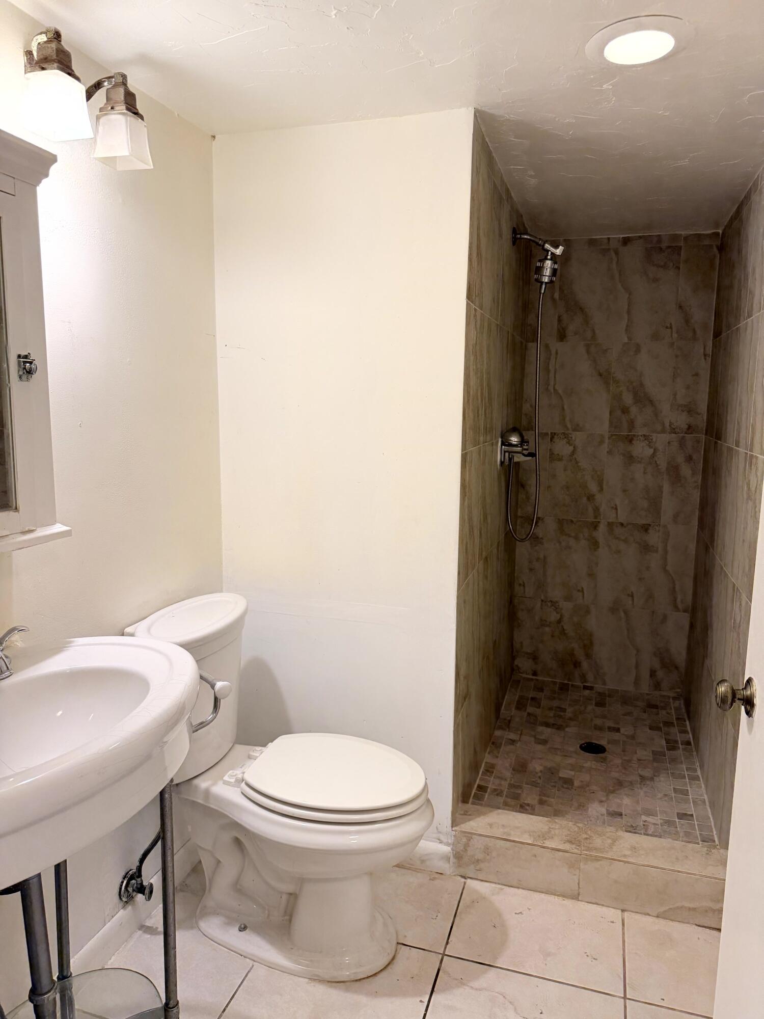 9300 Southwest 8th Street, Unit 107 Boca Raton, FL 33428 - Photo 14 of 23 Guest Bathroom