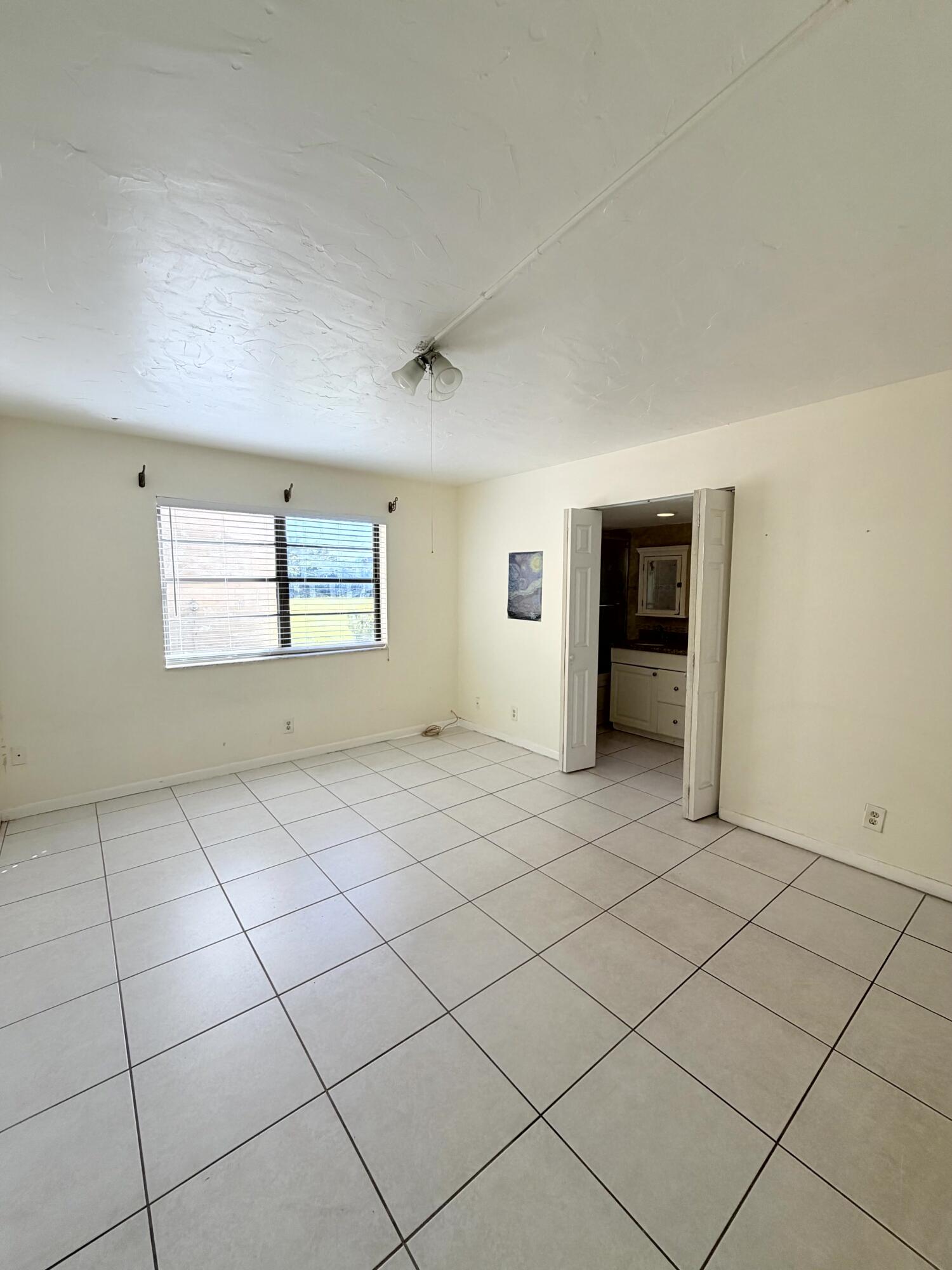 9300 Southwest 8th Street, Unit 107 Boca Raton, FL 33428 - Photo 16 of 23 Primary Bedroom