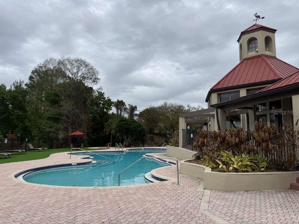 241 Afton Square, Unit 304 Altamonte Springs, FL 32714 - Photo 13 of 17 a front view of a house with a yard