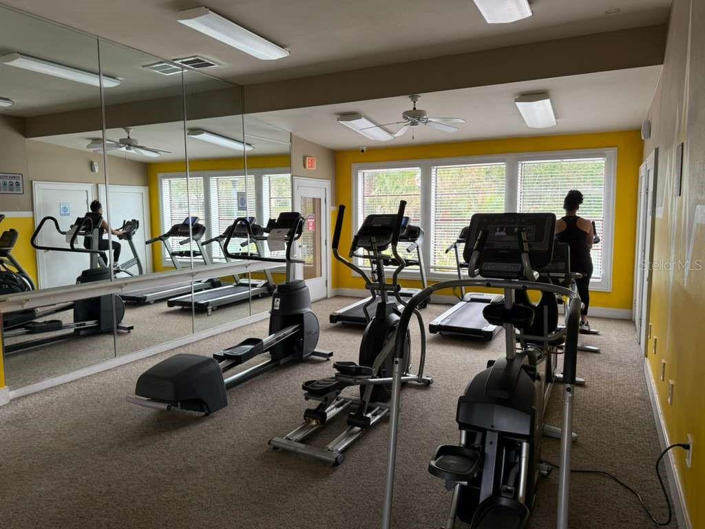 241 Afton Square, Unit 304 Altamonte Springs, FL 32714 - Photo 16 of 17 a view of a room with gym equipment