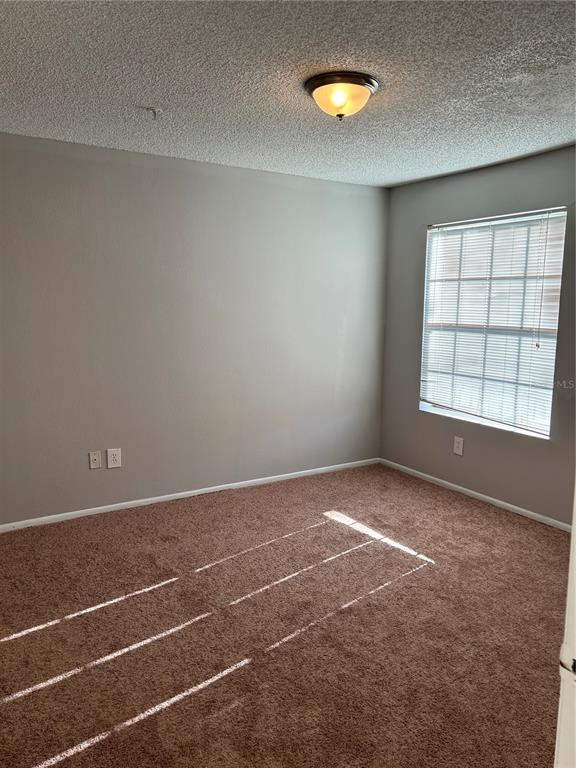 241 Afton Square, Unit 304 Altamonte Springs, FL 32714 - Photo 8 of 17 a view of an empty room with a window