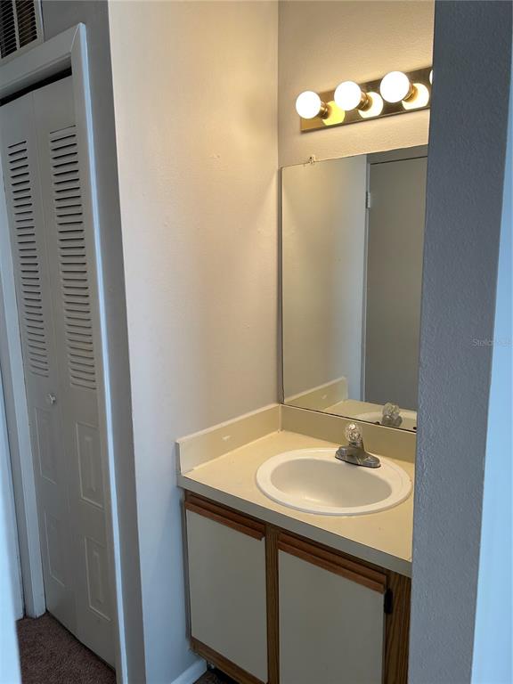 241 Afton Square, Unit 304 Altamonte Springs, FL 32714 - Photo 10 of 17 a bathroom with a sink and a mirror