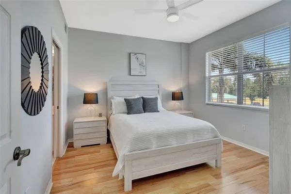 a bedroom with a bed and window