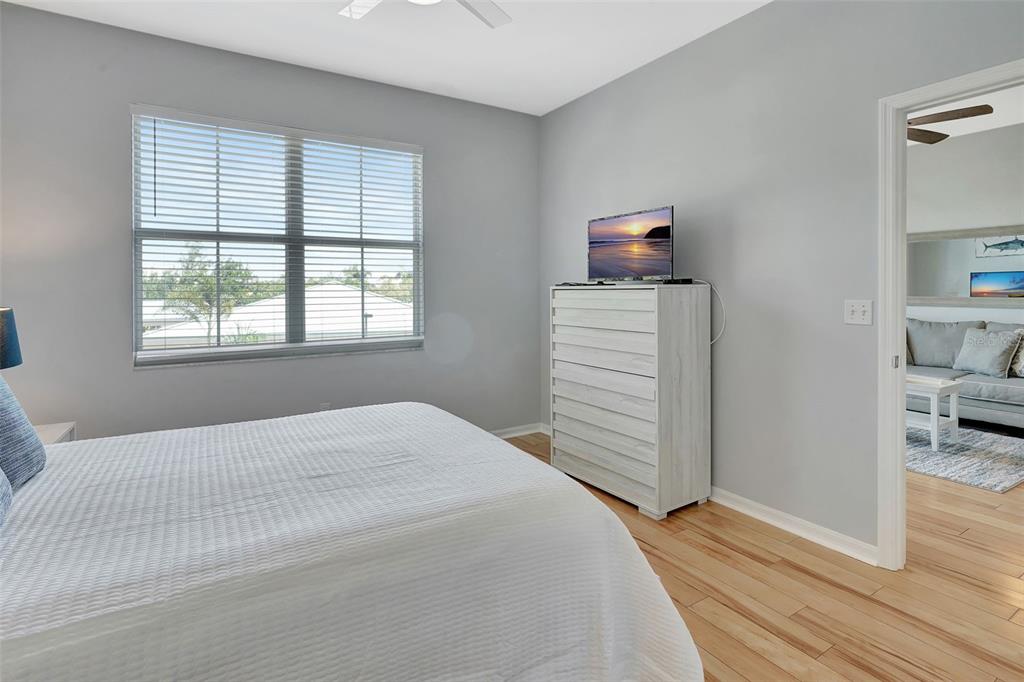 2090 Matecumbe Key Road, Unit 1207 Punta Gorda, FL 33955 - Photo 16 of 23 a bedroom with a bed and cabinets