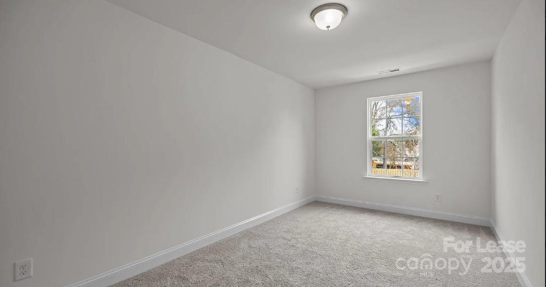 2035 Near Pt Road Charlotte, NC 28208 - Photo 11 of 13 an empty room with windows
