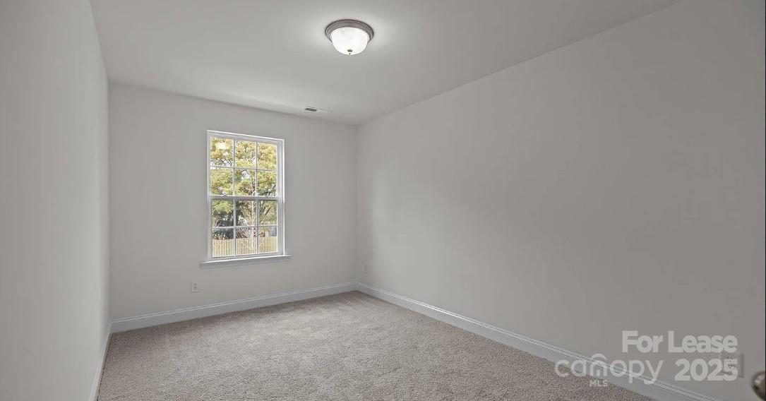 2035 Near Pt Road Charlotte, NC 28208 - Photo 12 of 13 an empty room with a window