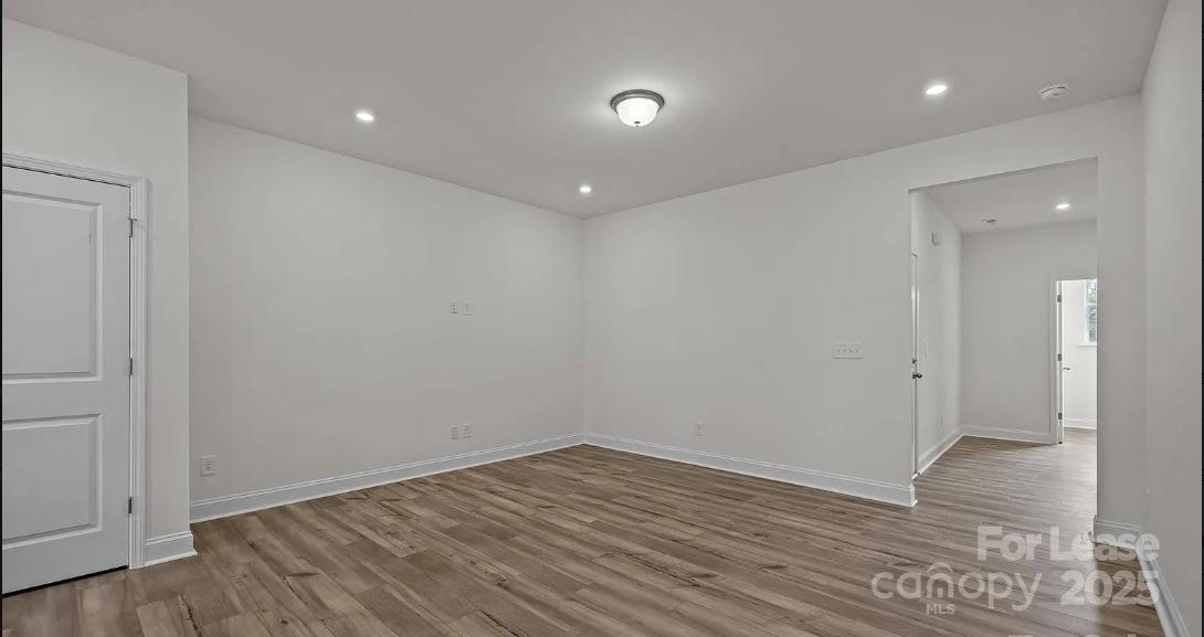 2035 Near Pt Road Charlotte, NC 28208 - Photo 3 of 13 a view of empty room with wooden floor