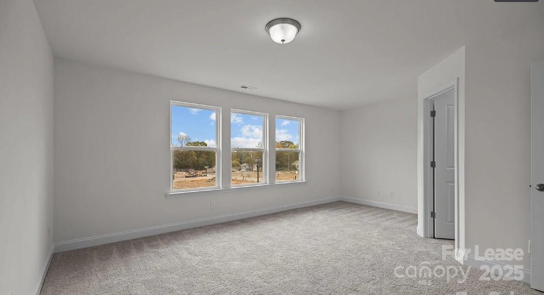 2035 Near Pt Road Charlotte, NC 28208 - Photo 7 of 13 a view of an empty room with a window