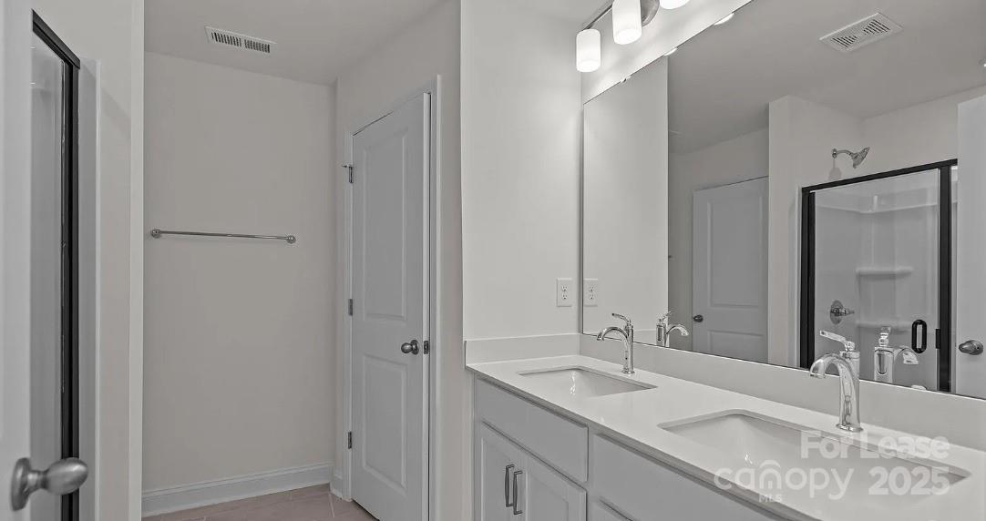 2035 Near Pt Road Charlotte, NC 28208 - Photo 9 of 13 a bathroom with a granite countertop sink and a mirror