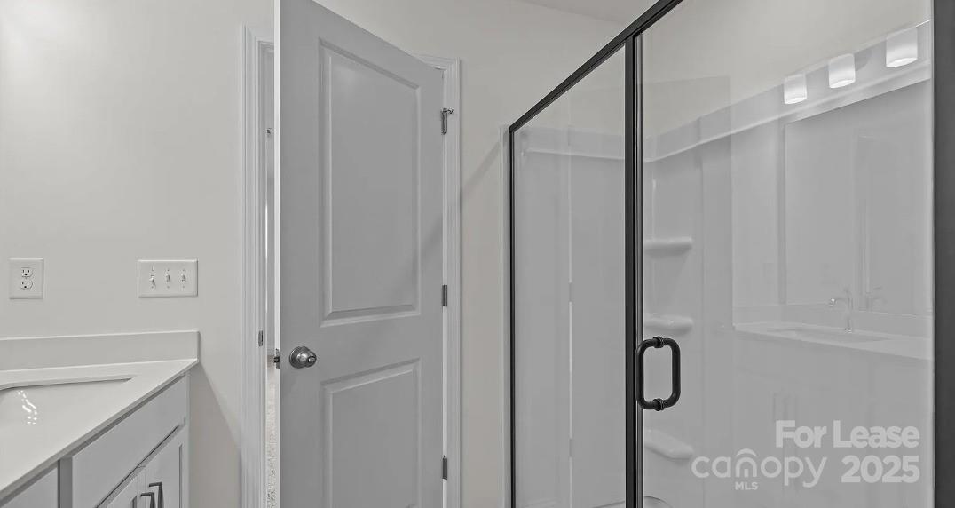 2035 Near Pt Road Charlotte, NC 28208 - Photo 10 of 13 a bathroom with a shower and a sink