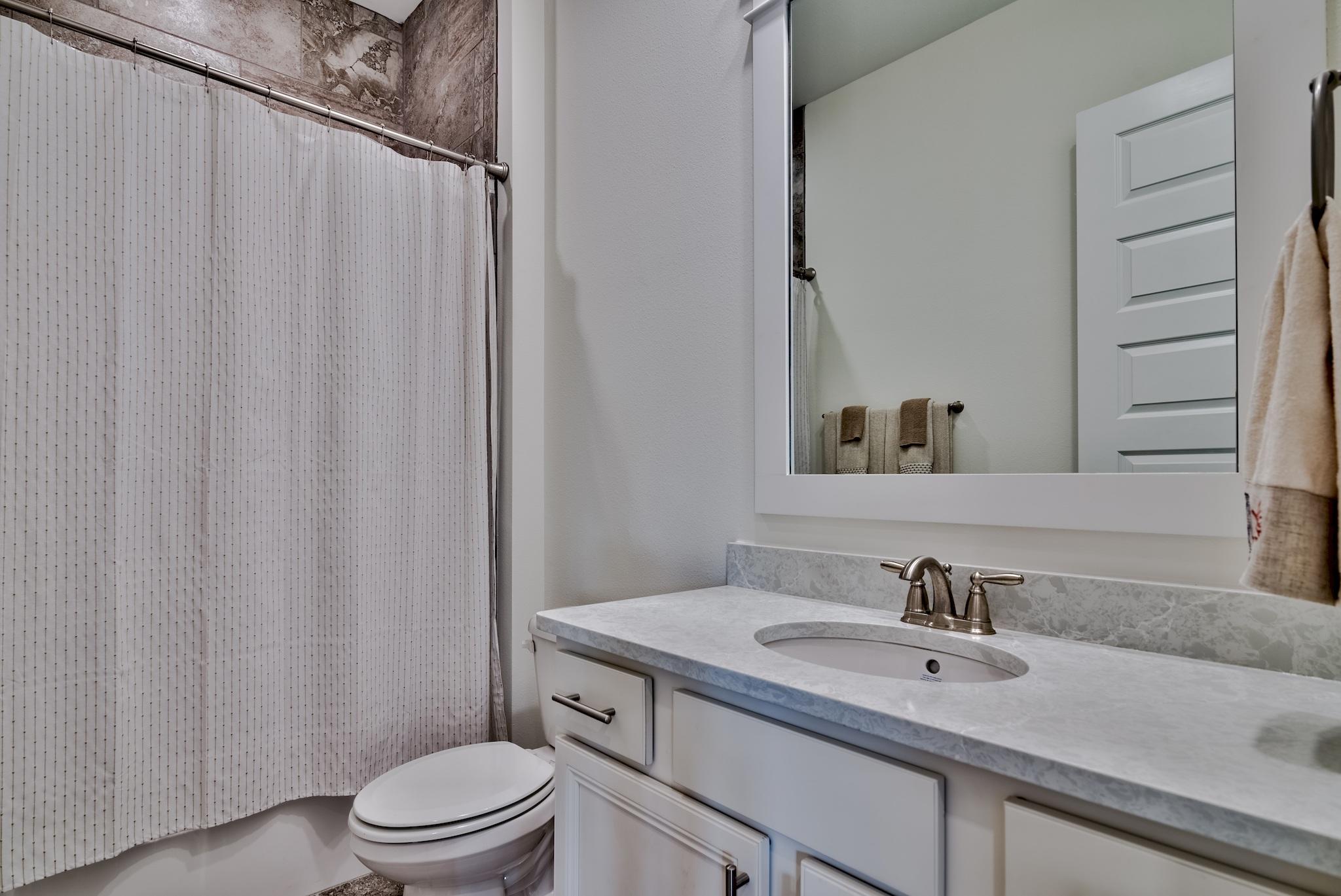 94 Milestone Drive Inlet Beach, Unit C Inlet Beach, FL 32461 - Photo 14 of 41 a bathroom with a sink toilet and shower